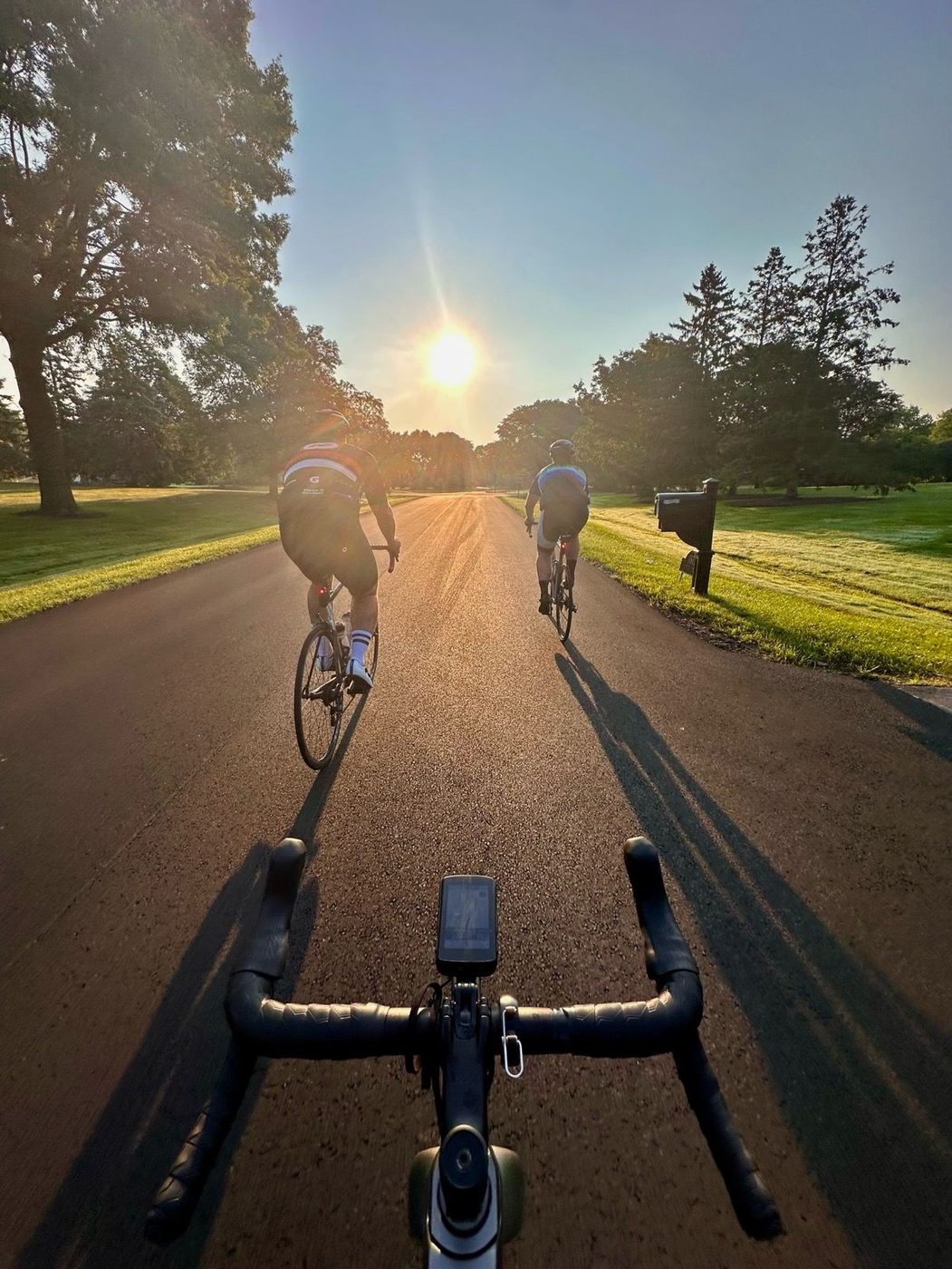 Two riders chasing the sunrise